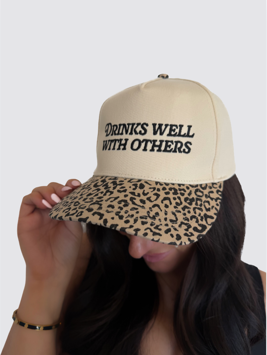 Drinks Well With Others Trucker Hat
